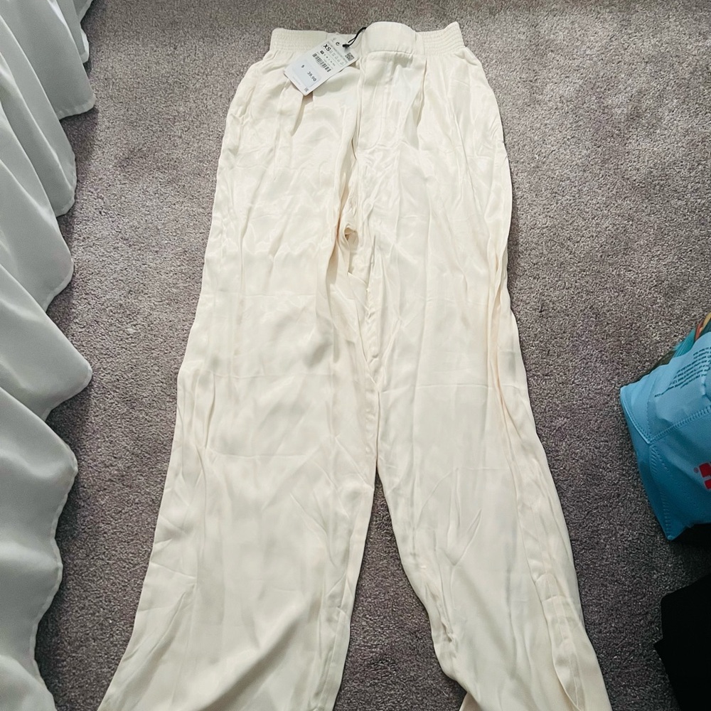 Cream Satin pants.